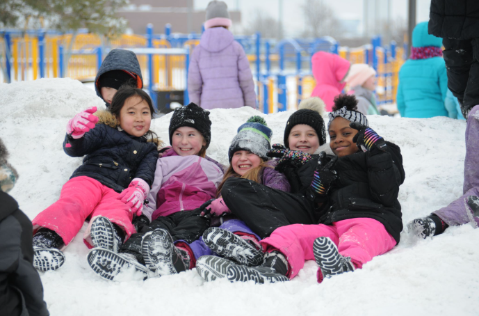  Children sit in snow